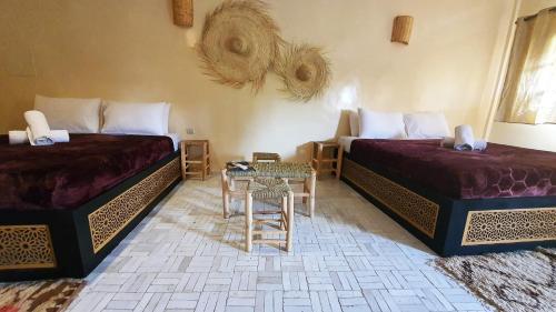 Una cama o camas en una habitación de Riad Batha