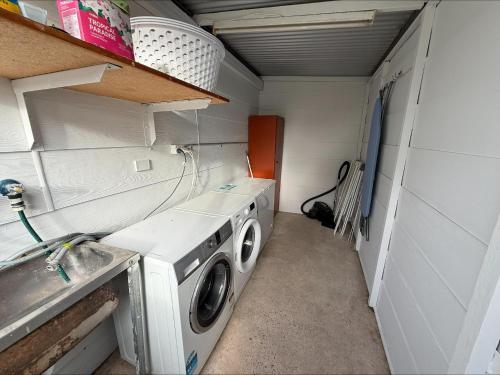 a washer and dryer in a small room at 3 by the Sea at Coobowie Unit 2 in Coobowie