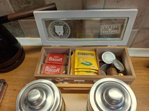 a wooden box with various items in it on a table at PREVEZA DOWNTOWN garden in Preveza