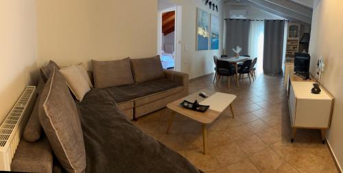 a living room with a couch and a table at Sami Loft in Sami