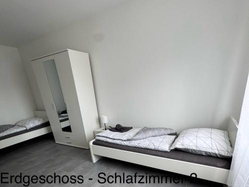 Postel nebo postele na pokoji v ubytování Zuhause auf Zeit in Efferen