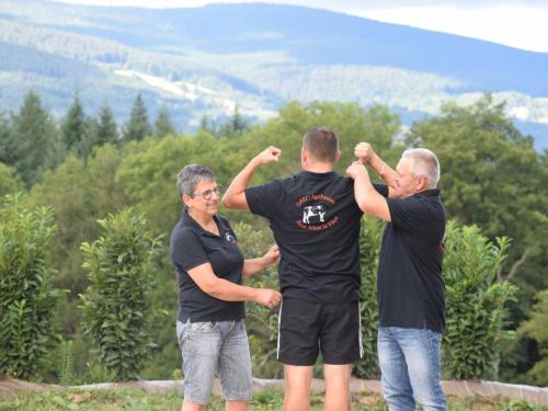 a group of three men standing on top of a mountain at Gîte Rustique avec Terrasse, Jardin Privatif et Visite de Ferme à Vêtre-sur-Anzon - FR-1-496-290 in Saint-Julien-la-Vêtre
