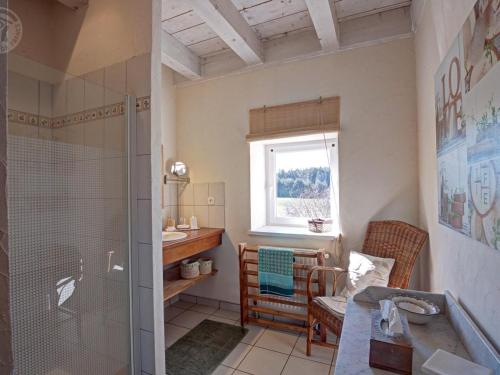 a bathroom with a shower and a sink at Gîte chaleureux avec poêle à bois, terrasse, wifi, proche activités nature - FR-1-496-268 in Saint-Régis-du-Coin