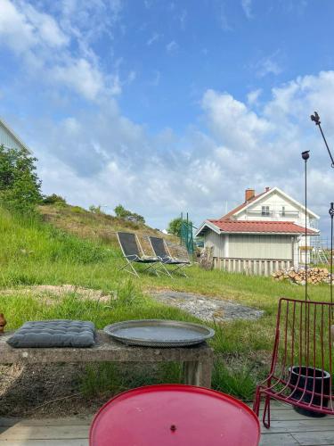a fire pit in a yard with a house at House Up On Ramberget In Mollösund in Mollösund