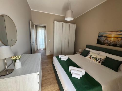 Postel nebo postele na pokoji v ubytování Palme Suites