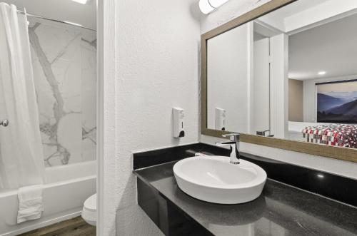 a bathroom with a sink and a mirror at Red Roof Inn Wytheville in Wytheville