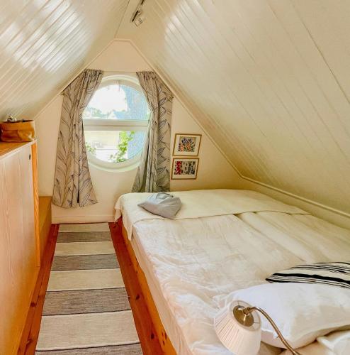 a bedroom with two beds in a tent at Serene Waterfront Oasis Your Resarö Sanctuary in Vaxholm