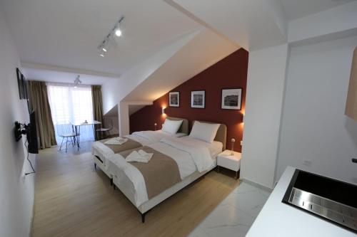 Ένα ή περισσότερα κρεβάτια σε δωμάτιο στο Vil Apartments
