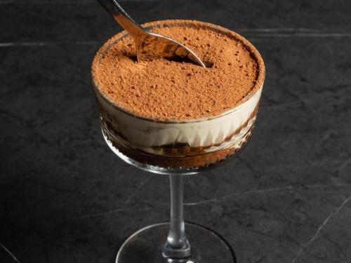 a chocolate cake in a wine glass with a spoon at Hotel Alba Adelaide in Adelaide