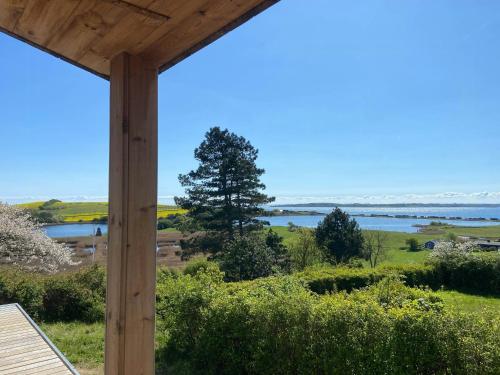 a view of the water from the porch of a house at Modern Summer House Overlooking The Water in Faaborg