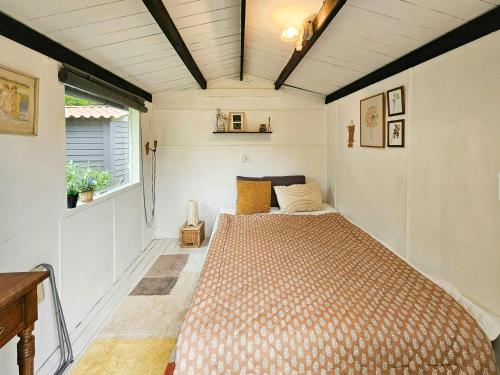 a bedroom with a bed in a small room at Holiday Home With Two Annexes Near The Sejerø Bay in Høve