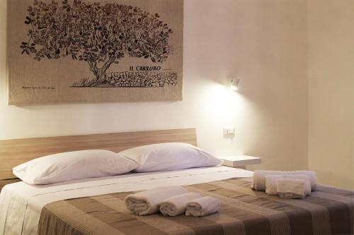 Ένα ή περισσότερα κρεβάτια σε δωμάτιο στο Radici Rooms