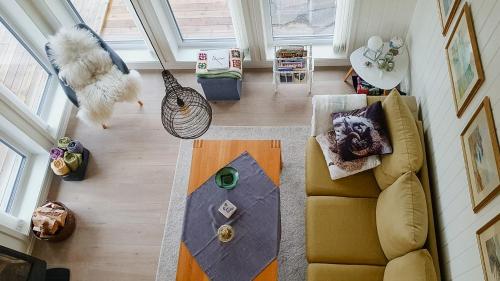an overhead view of a living room with a couch at Cabin In The Archipelago On The Island Kinn in Tansøy