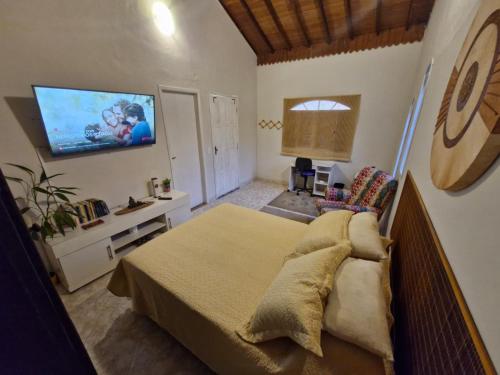 Μια τηλεόραση ή/και κέντρο ψυχαγωγίας στο Paz e sossego em Guapiaçu junto ao rio de águas cristalinas