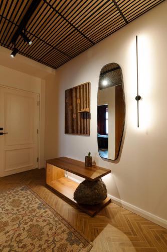 a room with a table and a mirror on the wall at Jannseni Residents in Pärnu