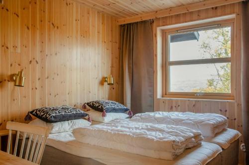 Ένα ή περισσότερα κρεβάτια σε δωμάτιο στο Architect-Designed Mountain House In Tänndalen