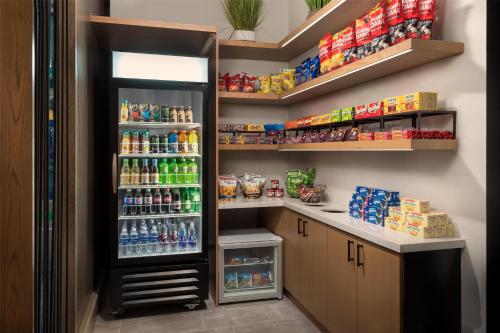 a refrigerator in a room with food and drinks at Hyatt Place National Harbor in National Harbor