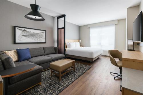 a living room with a couch and a bed at Hyatt Place National Harbor in National Harbor