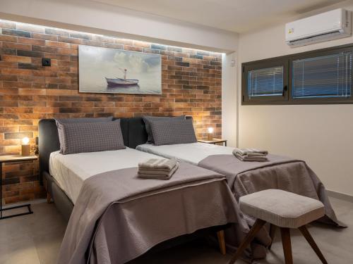 Postel nebo postele na pokoji v ubytování Lyttos - Vasilies NewTown Residences