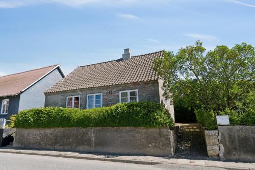 a house on the side of a street at The Cozy Cottage in Hirtshals