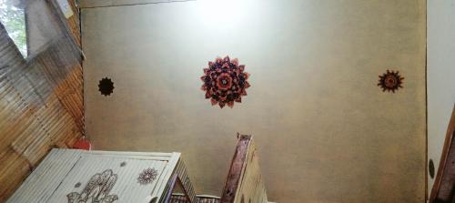 a room with some decorations on the wall at PINOY YOGA POLE PIYOPO LA UNION fan kubo 4 pax in Rimus