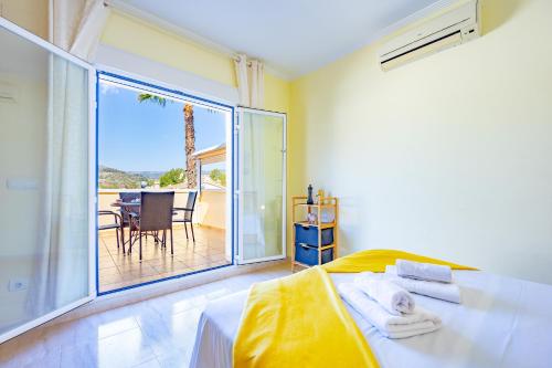 Posteľ alebo postele v izbe v ubytovaní Bungalow Rosa - PlusHolidays