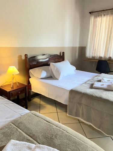 Katil atau katil-katil dalam bilik di Pousada Verona Paraty
