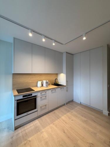 Η κουζίνα ή μικρή κουζίνα στο Poilsio Apartamentai