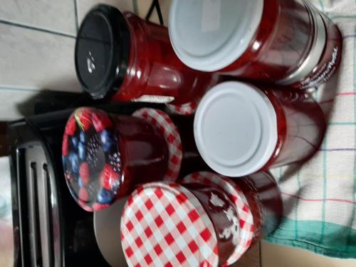 a group of red and white cups on a table at Brunnsteffl - Ferienhaus Lindner in Sankt Andrä-Höch