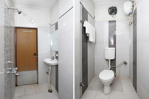 a bathroom with a toilet and a sink at Collection O Greenpark in Jamshedpur