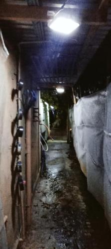 a dark alley with a bike parked in a tunnel at PINOY YOGA POLE PIYOPO LA UNION fan kubo 4 pax in Rimus