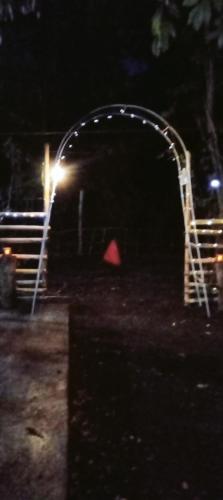 a playground at night with a red object at PINOY YOGA POLE PIYOPO LA UNION fan kubo 4 pax in Rimus