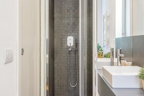 a bathroom with a sink and a shower at Next Stop Relax - Near Central Station in Modena