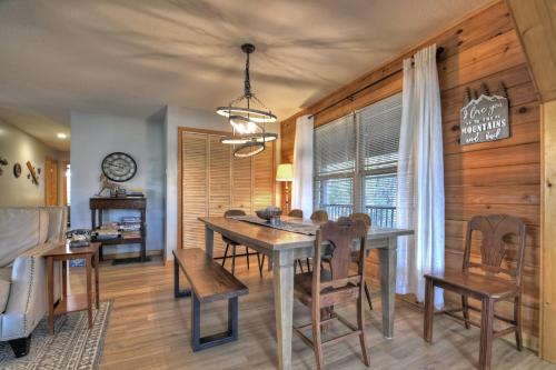 a dining room with a table and chairs at Moon Tower Cabin - Beautiful Water Views Firepit More in Blairsville