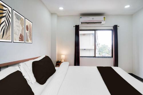 Ένα ή περισσότερα κρεβάτια σε δωμάτιο στο Hotel O HNG INN