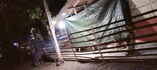 a house with a sheet on the side of it at night at PINOY YOGA POLE PIYOPO LA UNION fan kubo 4 pax in Rimus