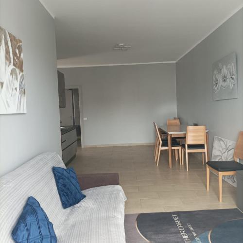 a room with a bed and a table and chairs at Boavista Estoril Residence Sol & Mar in Sal Rei