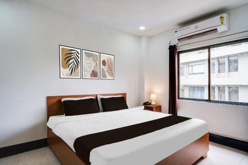 Ένα ή περισσότερα κρεβάτια σε δωμάτιο στο Hotel O HNG INN