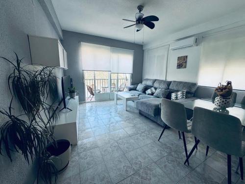 a living room with a couch and a table at MATEO Centro in Cazorla