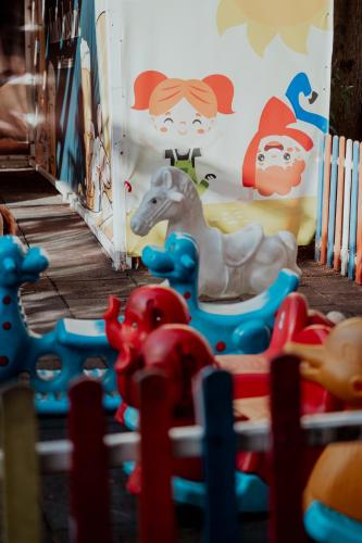 a group of plastic toy horses in a play room at Kulla Inglizit in Shkodër