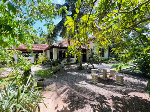 a house with a picnic table in front of it at Krishan Villa in Negombo