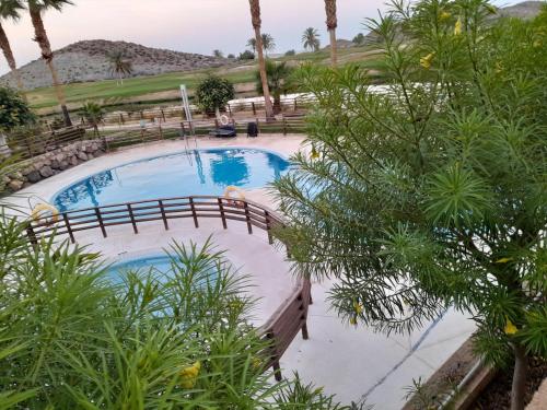 an overhead view of a swimming pool with trees at Cómodo apartamento con WiFi y estacionamiento en Pulpí, cerca de la playa - ES-376-14 in Pulpí