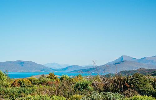 a view of a lake with mountains in the background at Creag Dubh in Camastianavaig