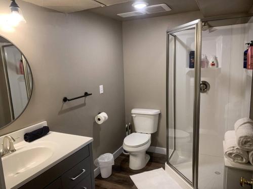 a bathroom with a shower and a toilet and a sink at No Cleaning Fee BYU Creamery WD 65 TV King in Provo