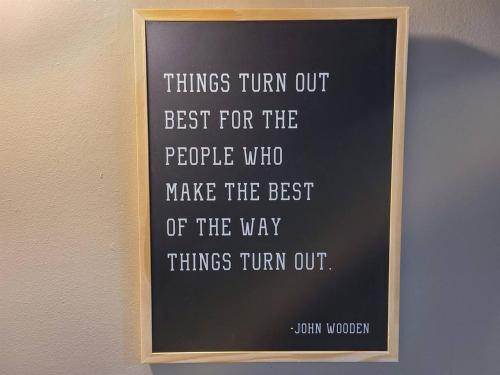 a framed sign on a wall with words things turn out best for the people who at No Cleaning Fee BYU Creamery WD 65 TV King in Provo