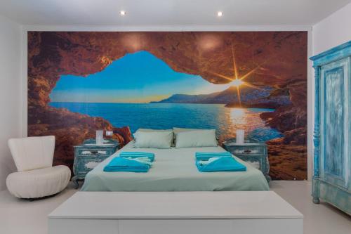 a bedroom with a bed with a view of the ocean at Villa Lunamoon, Playa Blanca in Playa Blanca