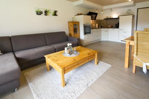 a living room with a couch and a coffee table at Sophie -203- in Mittenwald