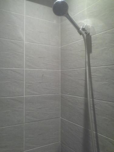 a shower with a shower head in a bathroom at Princess resort unit number 260A Markos in Hurghada