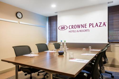 a conference room with a table and chairs at Crowne Plaza Manchester Airport by IHG in Hale
