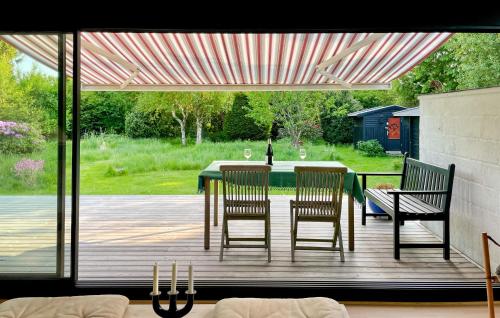 a patio with two chairs and a table and a table and chairs at 2 Bedroom Beautiful Home In Gilleleje in Gilleleje